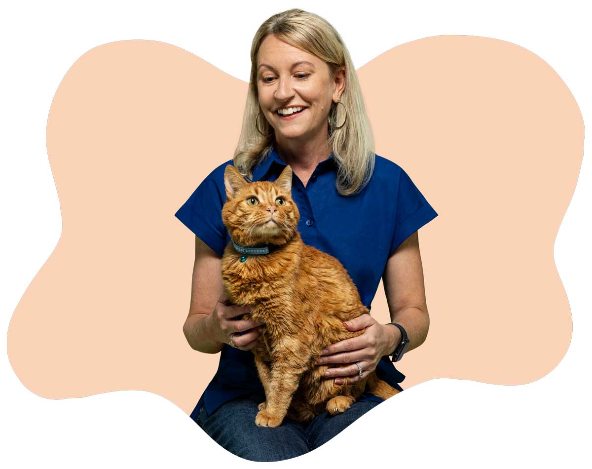 20250423_013 Loralee Stapleton, Marketing Director, holding her orange cat Zeus