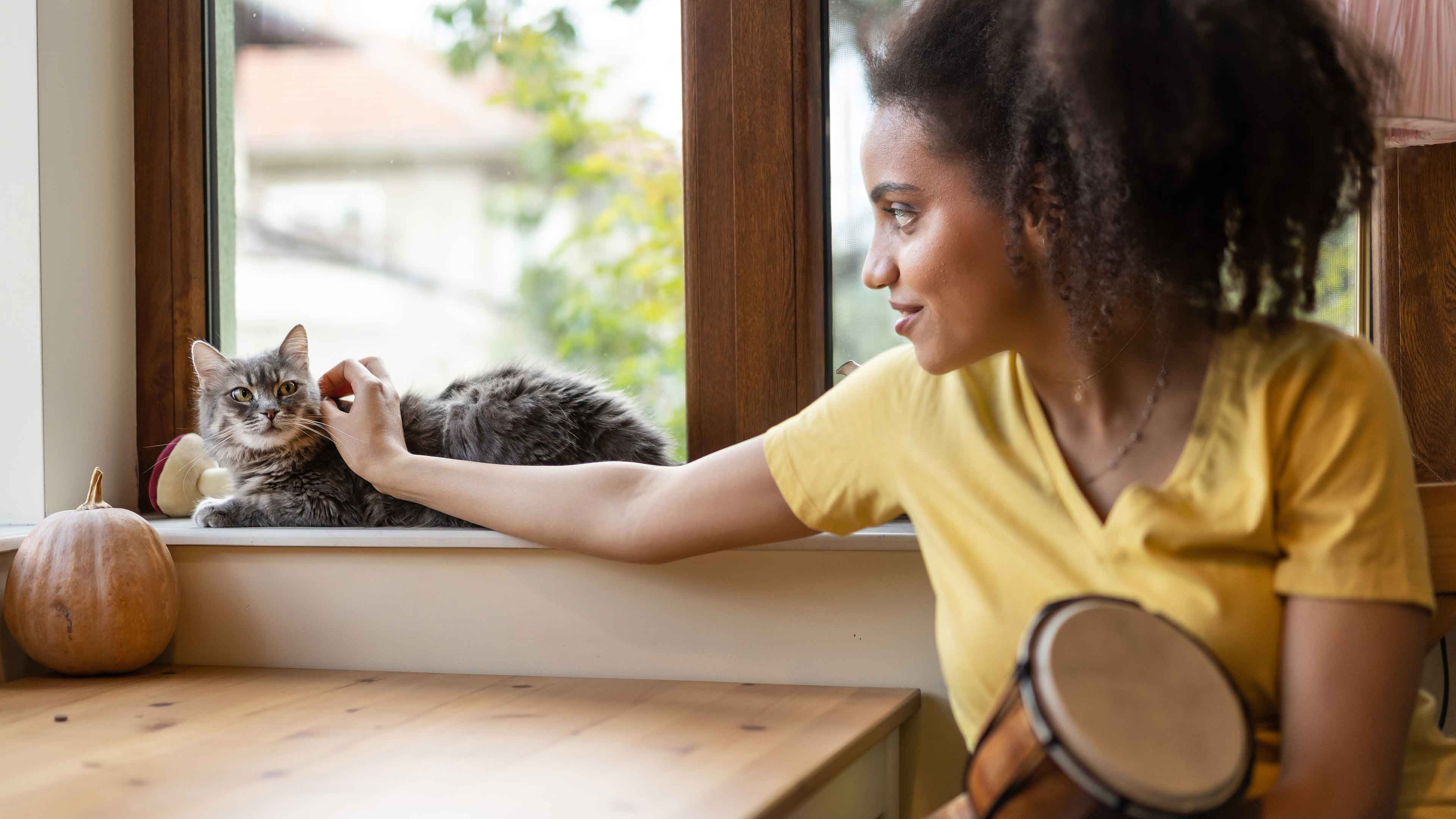 woman petting cat