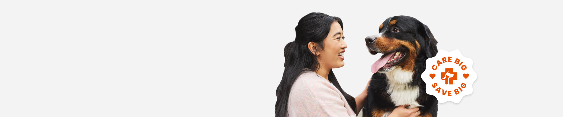 A woman looks lovingly at her dog