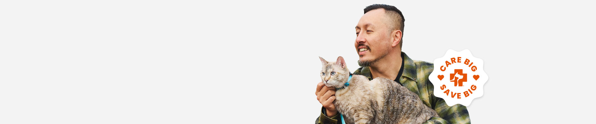 A man holding a cat