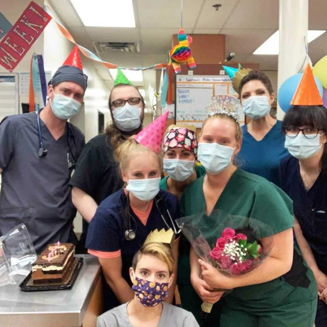 A group of associates celebrating a milestone at the Banfield Pet Hospital
