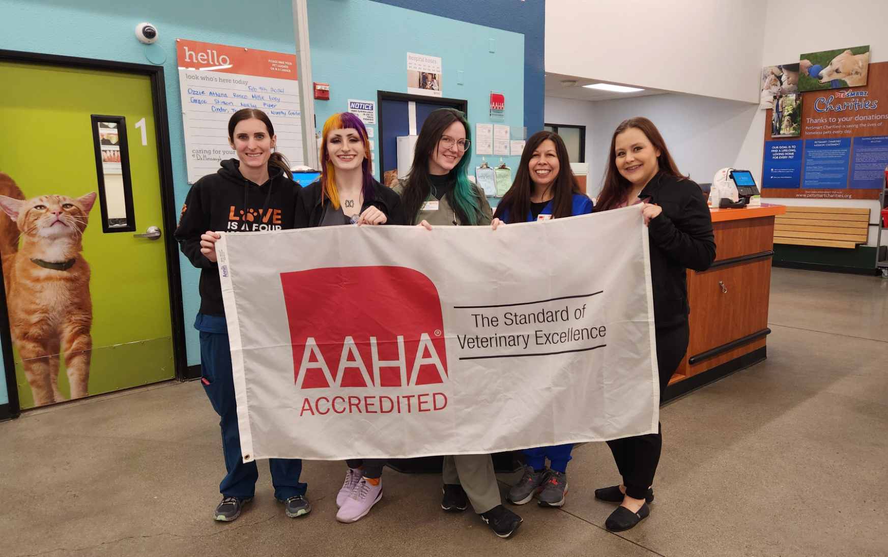 The staff displaying the AAHA certification banner